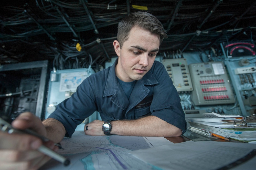 USS America Sailor plots ship’s course