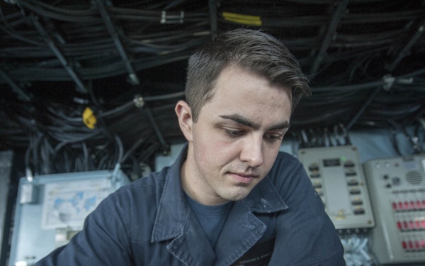 USS America Sailor plots ship’s course