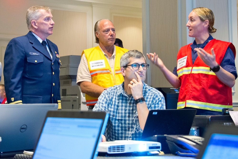Coast Guard district commander receives operational brief from ESF 10 Florida