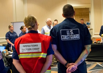 Coast Guard district commander receives operational brief from ESF 10 Florida
