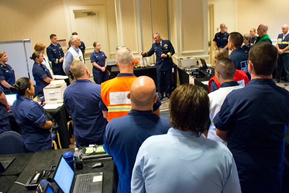 Coast Guard district commander receives operational brief from ESF 10 Florida