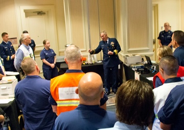 Coast Guard district commander receives operational brief from ESF 10 Florida