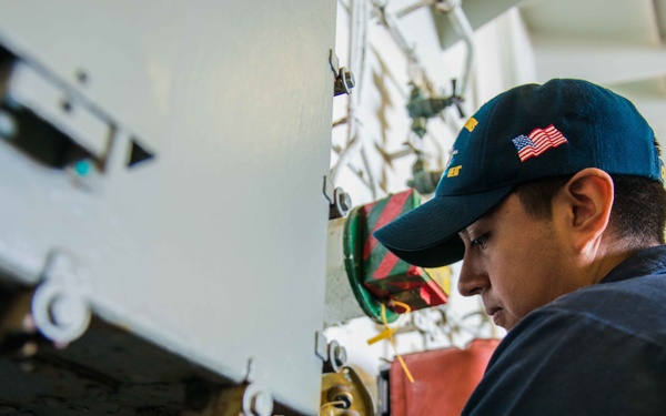 Sailor Conducts Maintenance