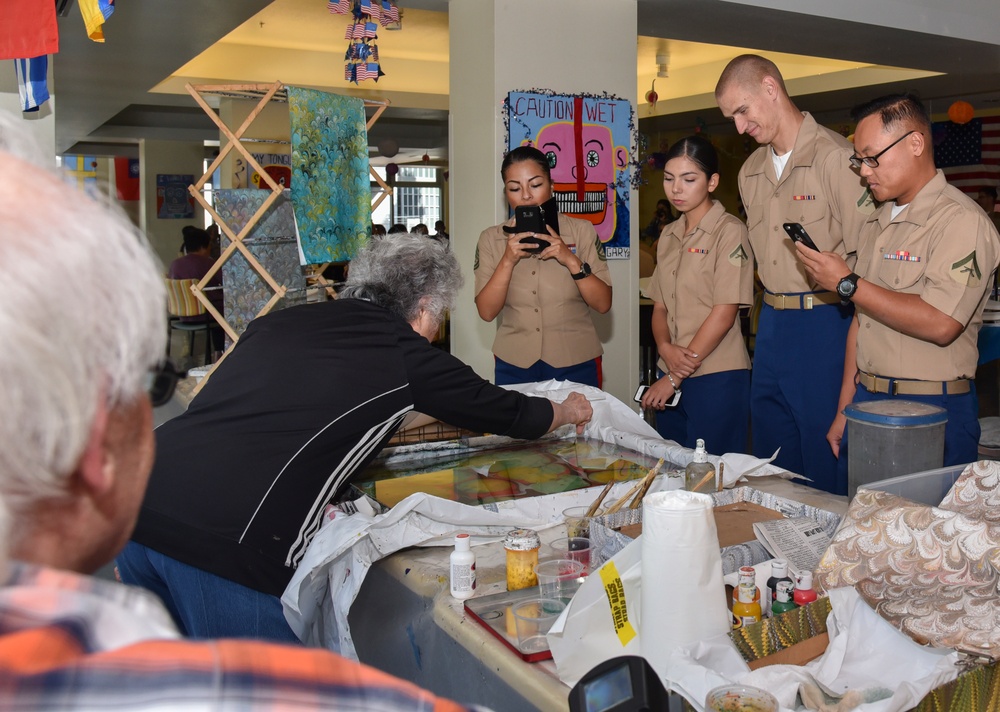 Sailors and Marines Participate in Tea with the Troops
