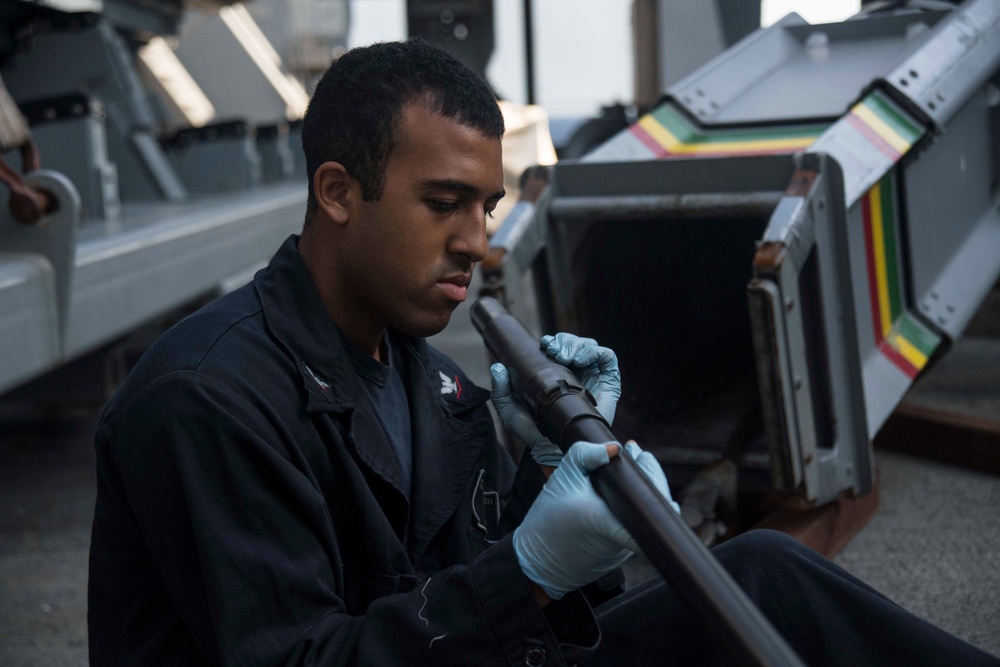 USS San Diego (LPD 22) Gunner's Mate Conducts Maintenance on .50 Caliber Machine Gun