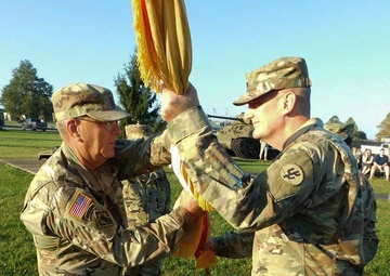 Col. Smith Passes the Colors to Command Sgt. Maj. Ploeger for Safekeeping
