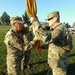 Col. Smith Passes the Colors to Command Sgt. Maj. Ploeger for Safekeeping