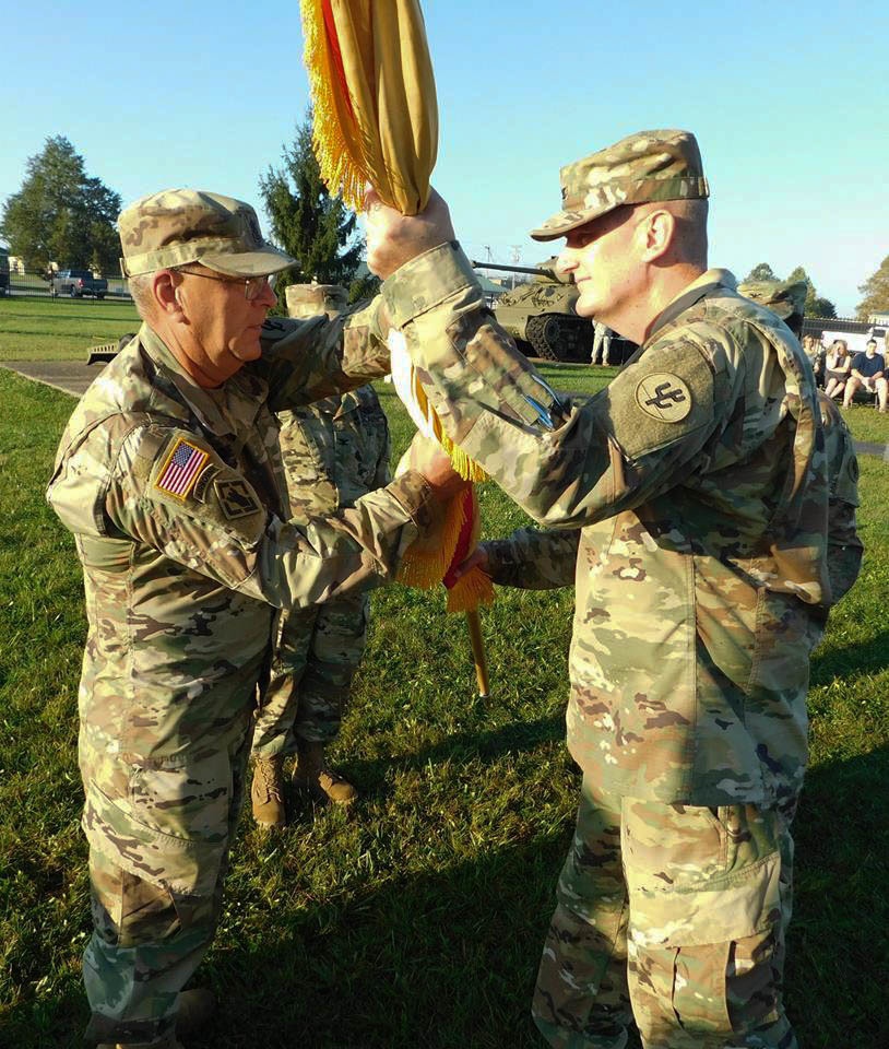 Col. Smith Passes the Colors to Command Sgt. Maj. Ploeger for Safekeeping