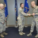Command Chief Anderson Presents Coin during Visit To 117 ARW