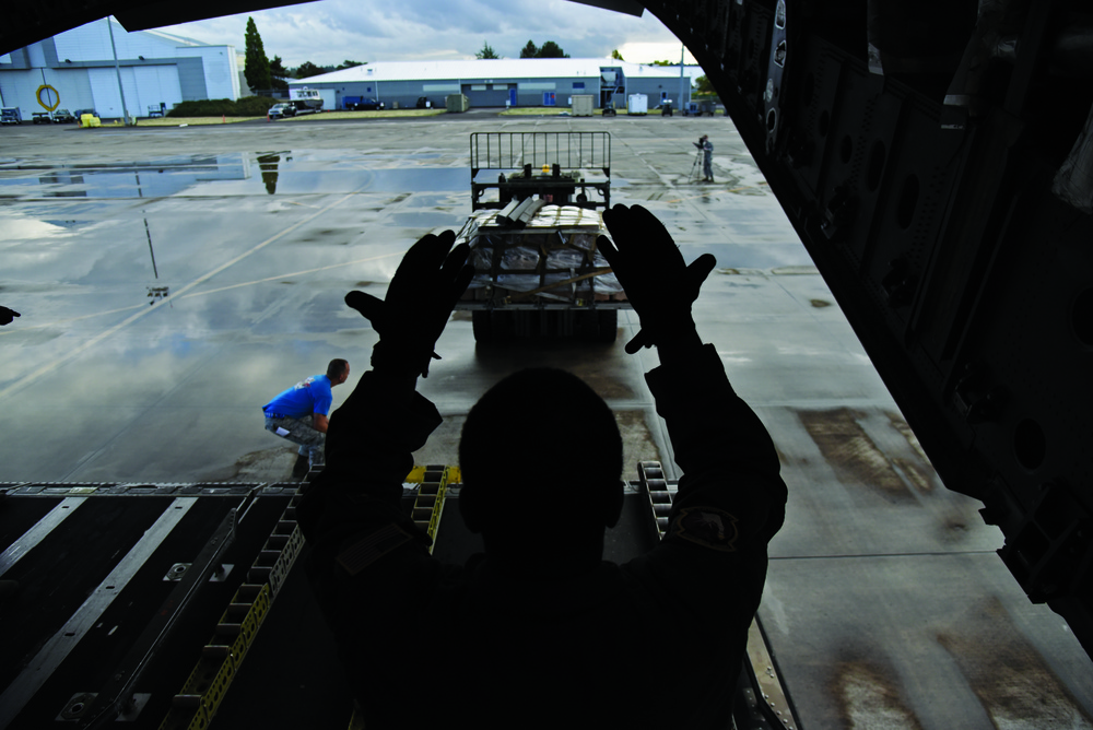 Air National Guard Airmen load supplies for Hurricane Maria relief