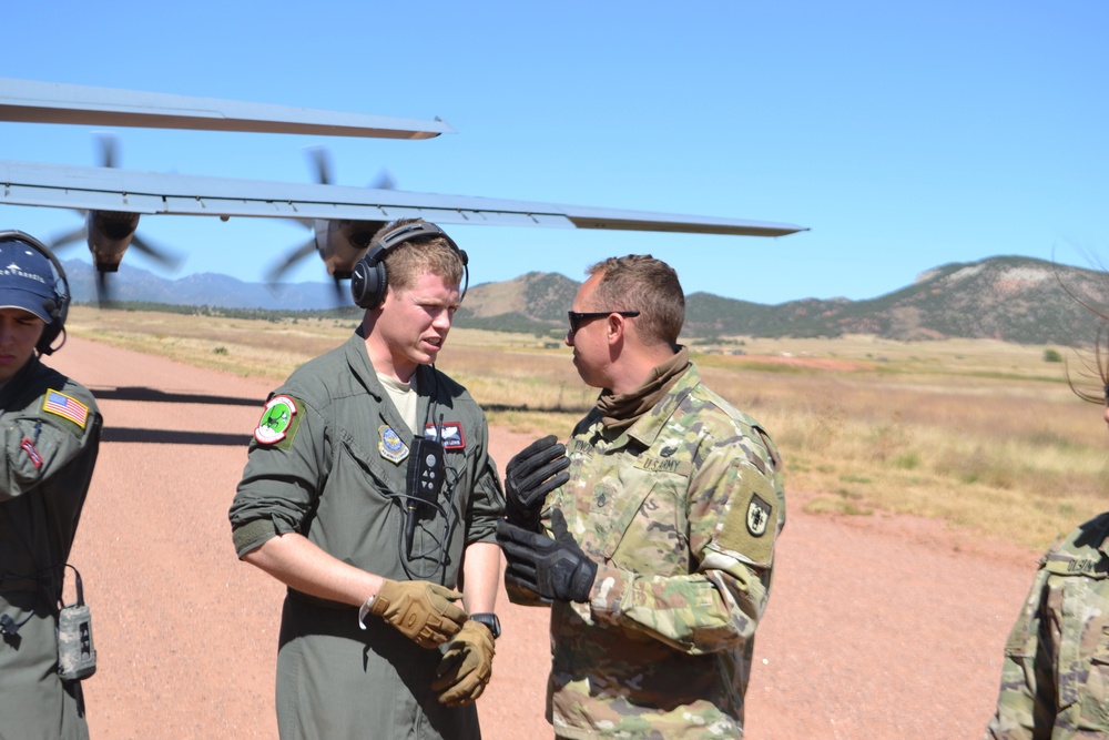 Colorado Army National Guard conduct C-130 airlift and HIMARS Hot-Pannel training.