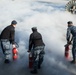 Sailors discharge a CO2 bottle.