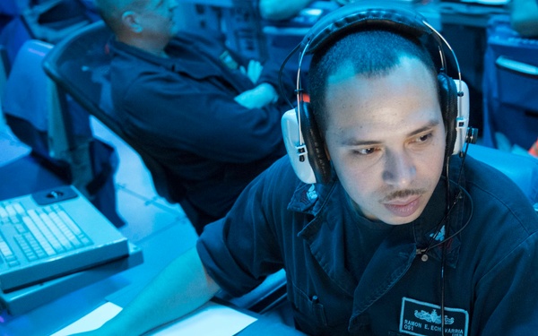 USS Lake Erie (CG 70) Sailor stands watch in CIC