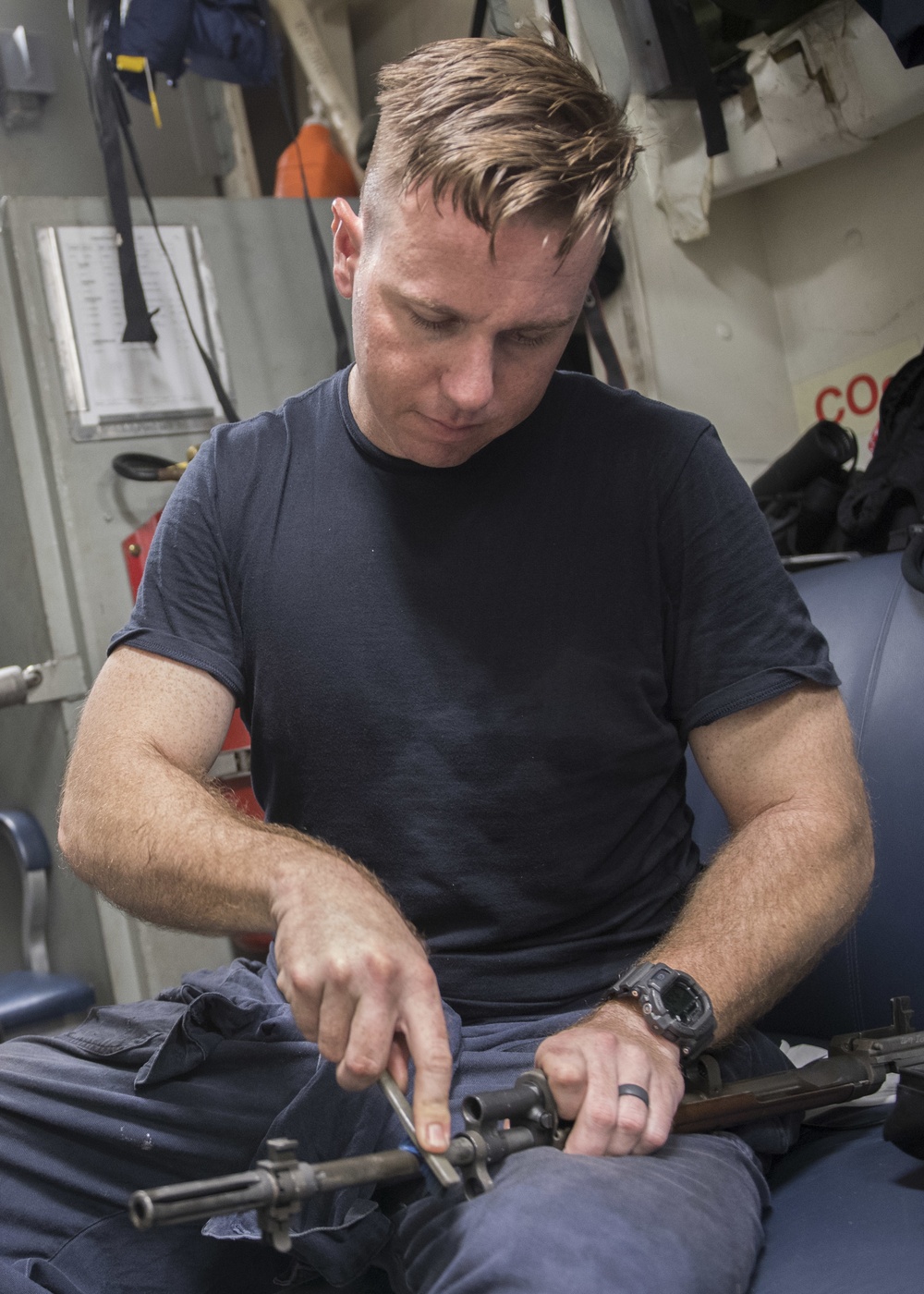 USS Lake Erie (CG 70) cleans M14 rifle