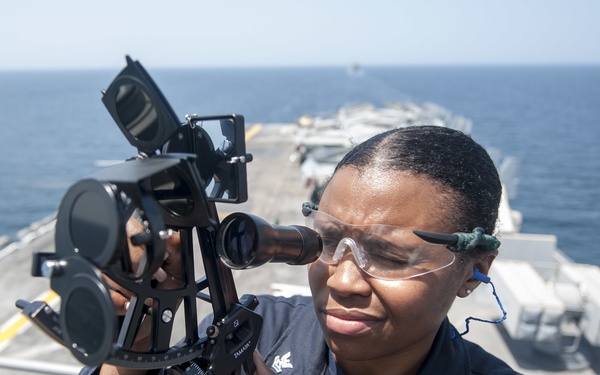USS America Sailor plots course