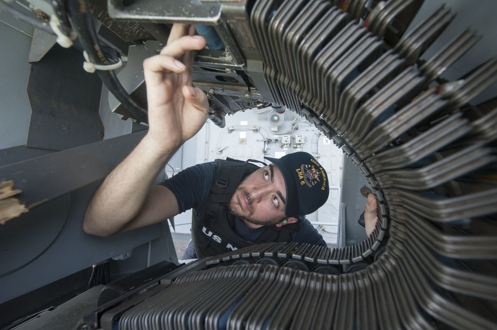 USS America Sailors load MK-38