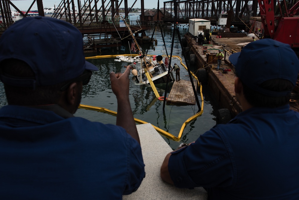 Coast Guard monitors recovery of sunken boat in Boston Harbor