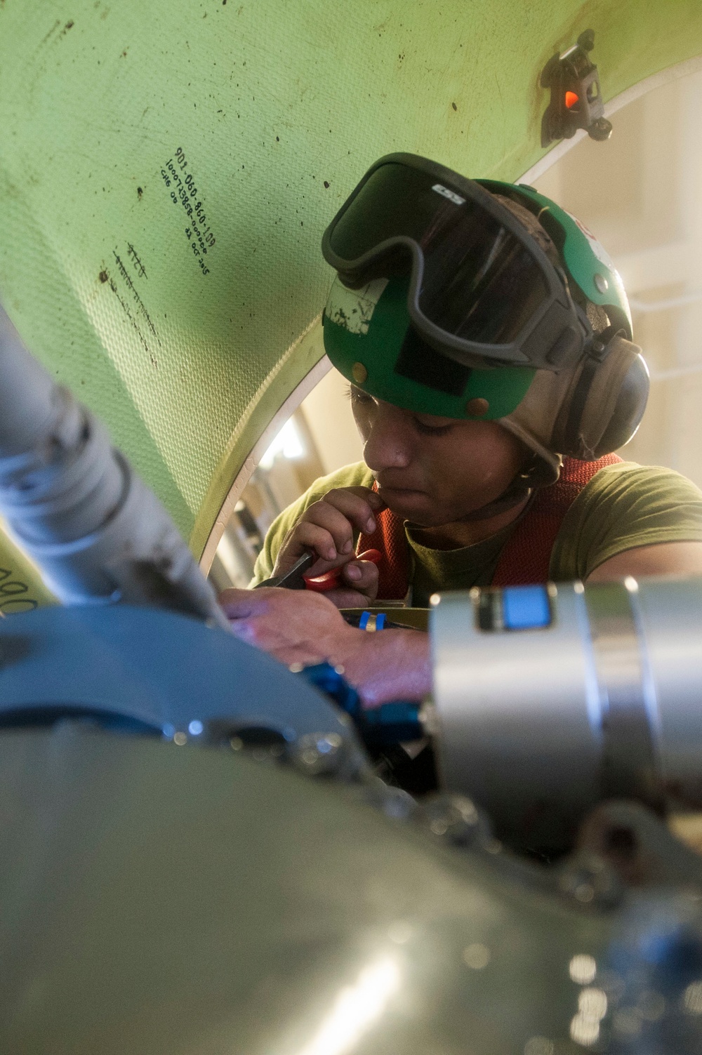 USS America Sailors and Marines conduct aircraft maintenance