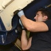Sailor Performs Maintenance On Hatch