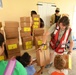 Red Cross Volunteers Help Hand Out Supplies to Local Residents