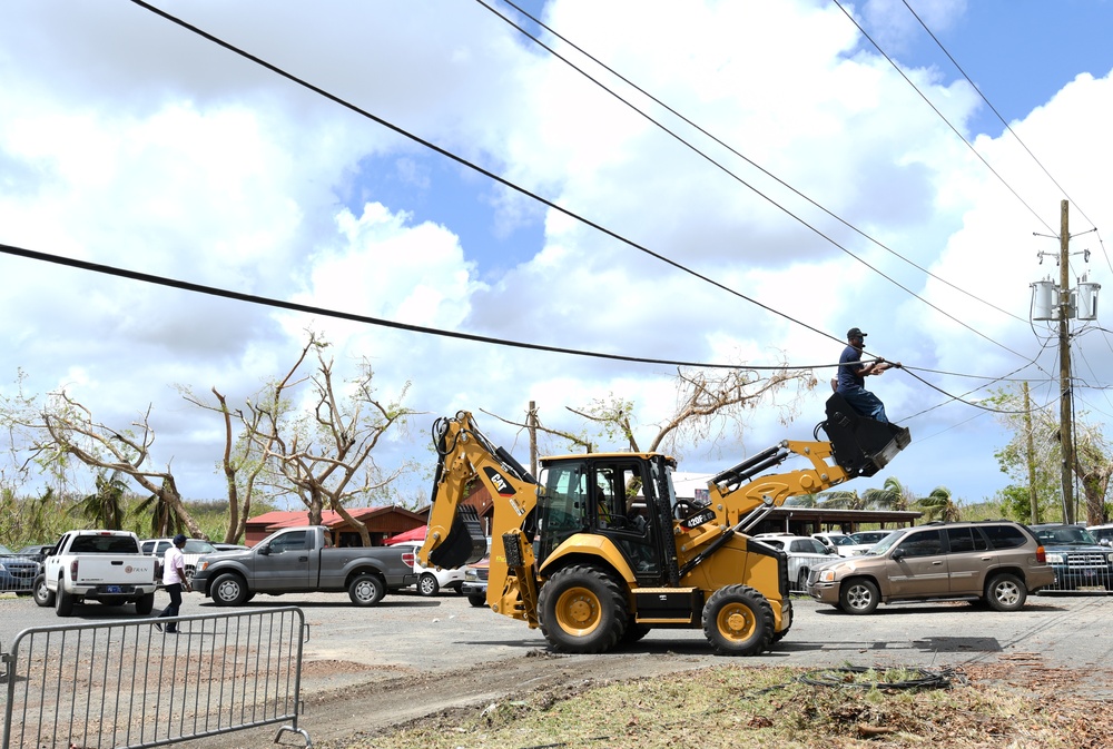 Teams Work to Repair Power Lines and Poles in St. Croix