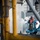 Sailors paint the ship.