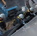 Sailors paint the ship.