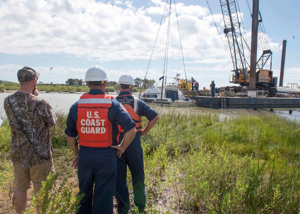 Cabin cruiser sunk by Hurricane Harvey refloated in Baytown, Texas