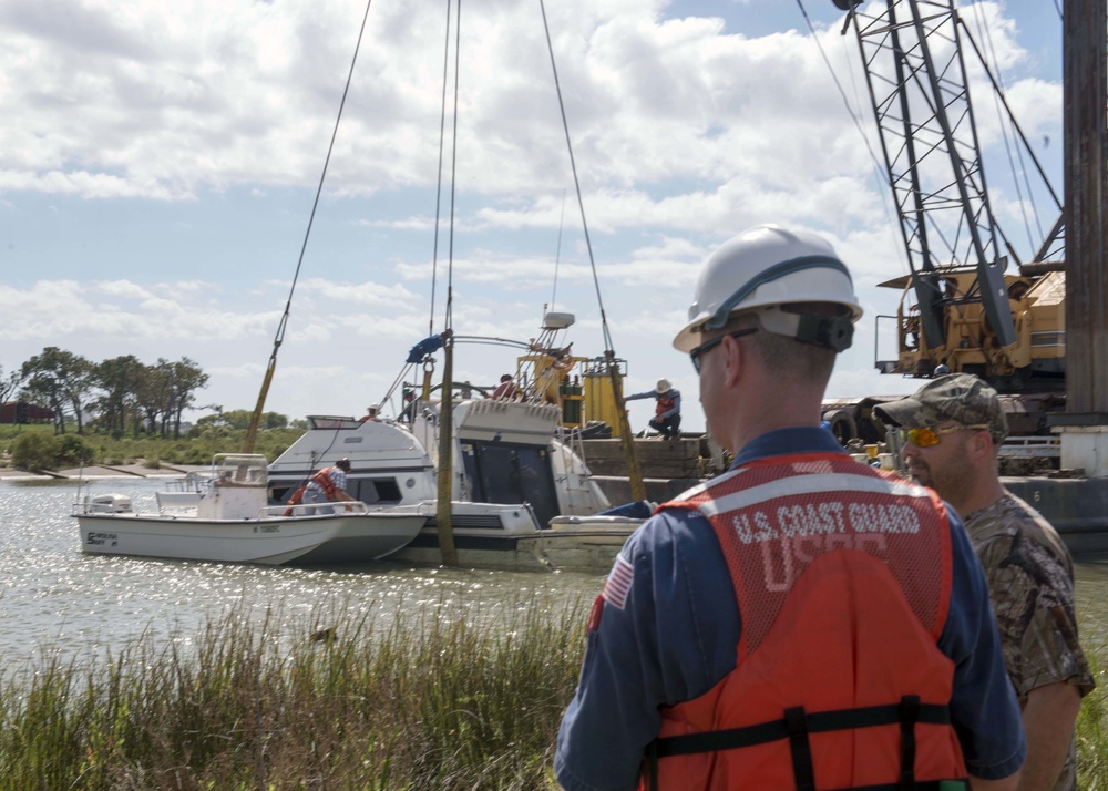 Cabin cruiser sunk by Hurricane Harvey refloated in Baytown, Texas