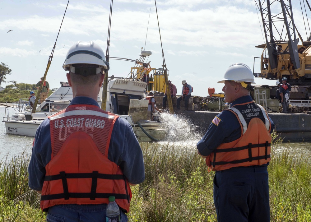 Cabin cruiser sunk by Hurricane Harvey refloated in Baytown, Texas