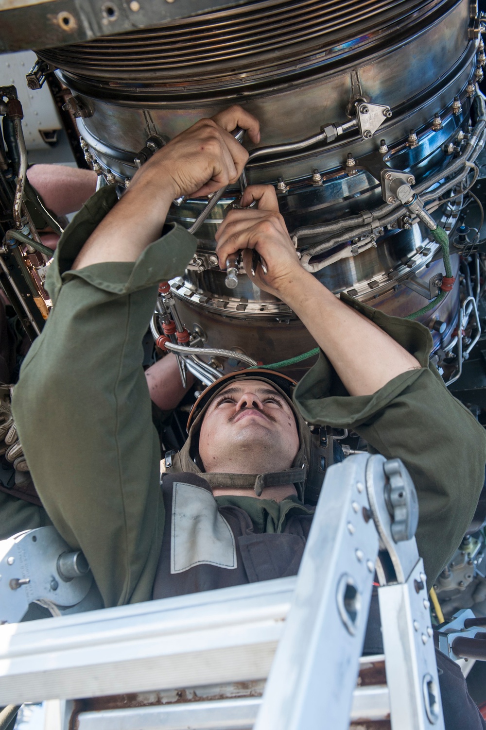 USS America Sailors and Marines conduct aircraft maintenance