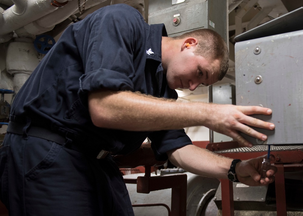 USS Lake Erie (CG 70) Sailor tests bromide levels