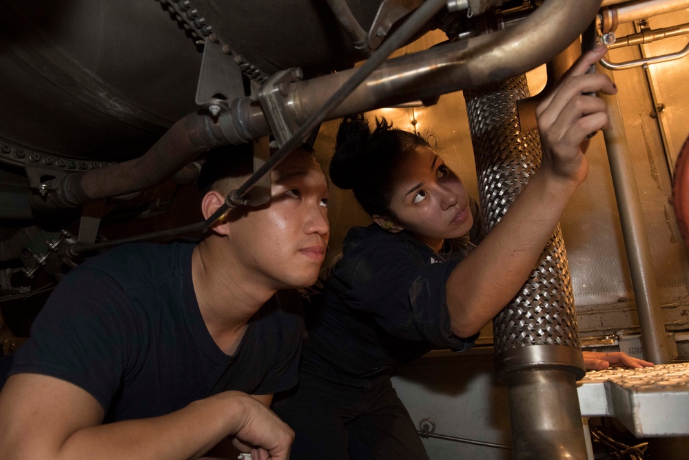 USS Lake Erie (CG 70) engineers perform engine maintenance