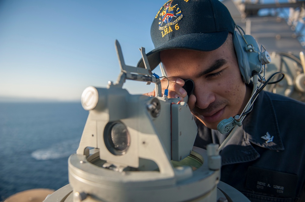 USS America Sailors measure ship’s bearing