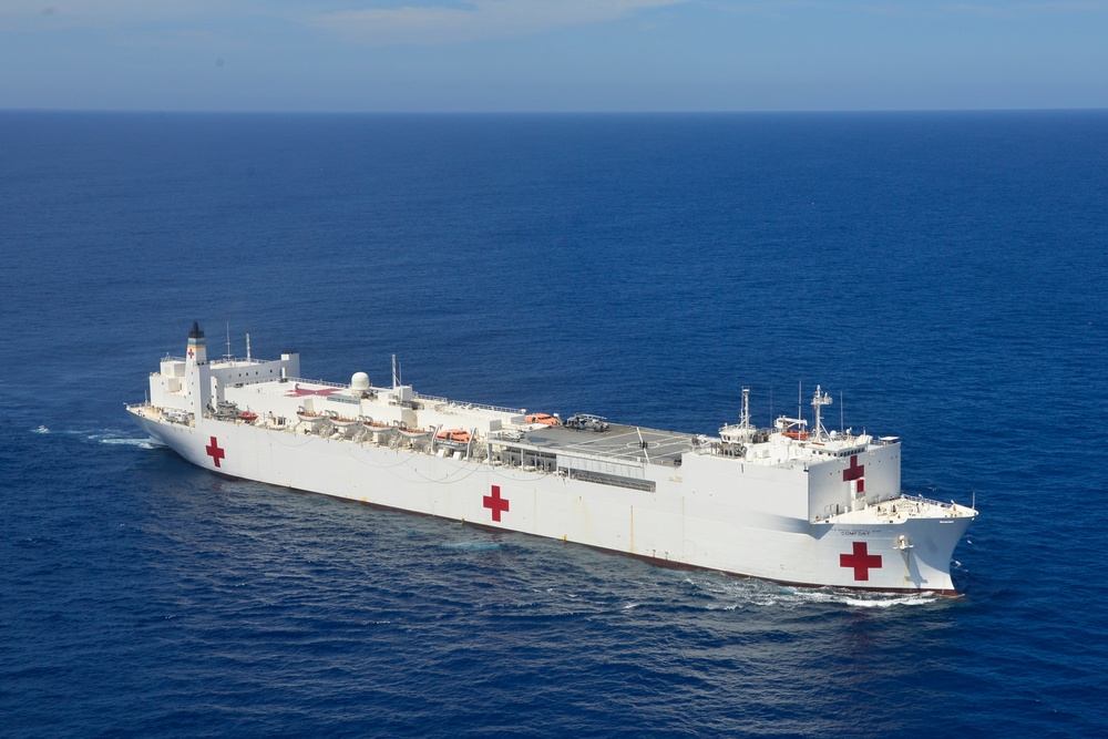 Coast Guard helicopter crew conducts overflights of USNS Comfort