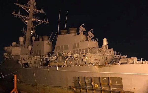 USS John S. McCain moves to heavy lift