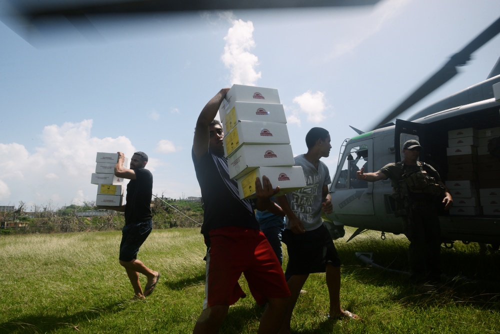 Residents of Mariana Sector Unloading Food &amp; Water