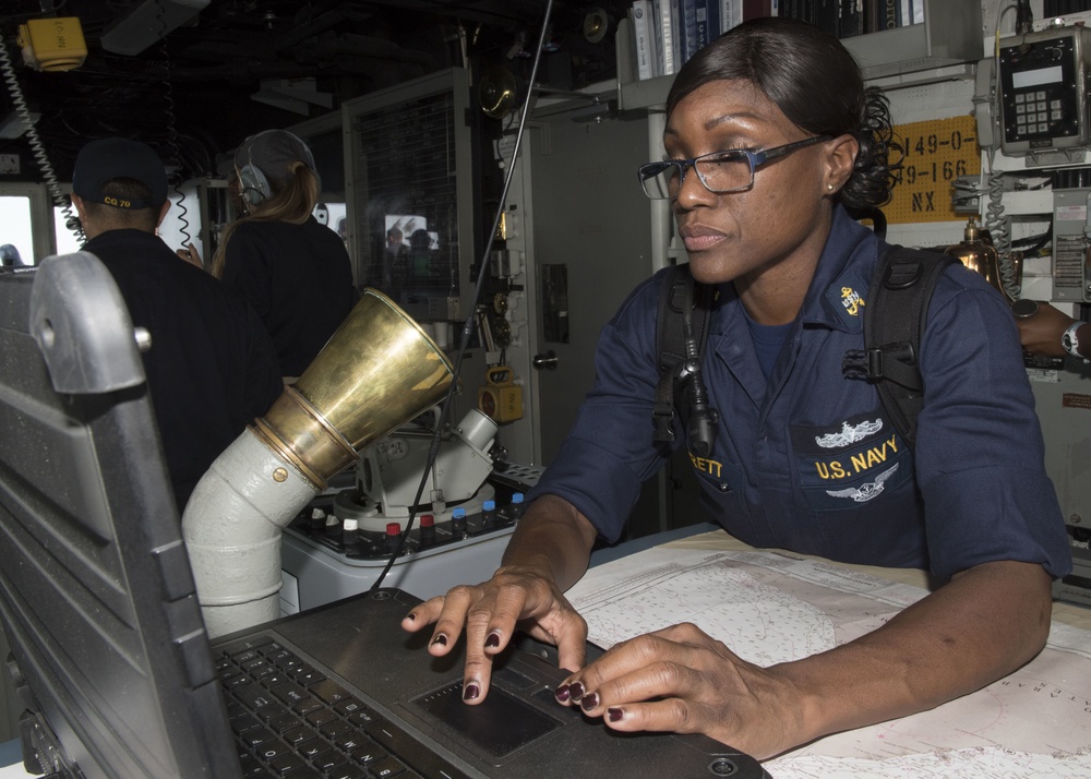USS Lake Erie (CG 70) Chief Quartermaster stands watch