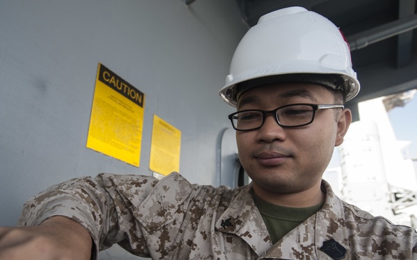 USS America Sailor adjust MK-38