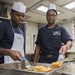 USS Lake Erie (CG 70) Sailors prepare a meal