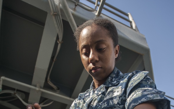 USS America Sailor adjust MK-38