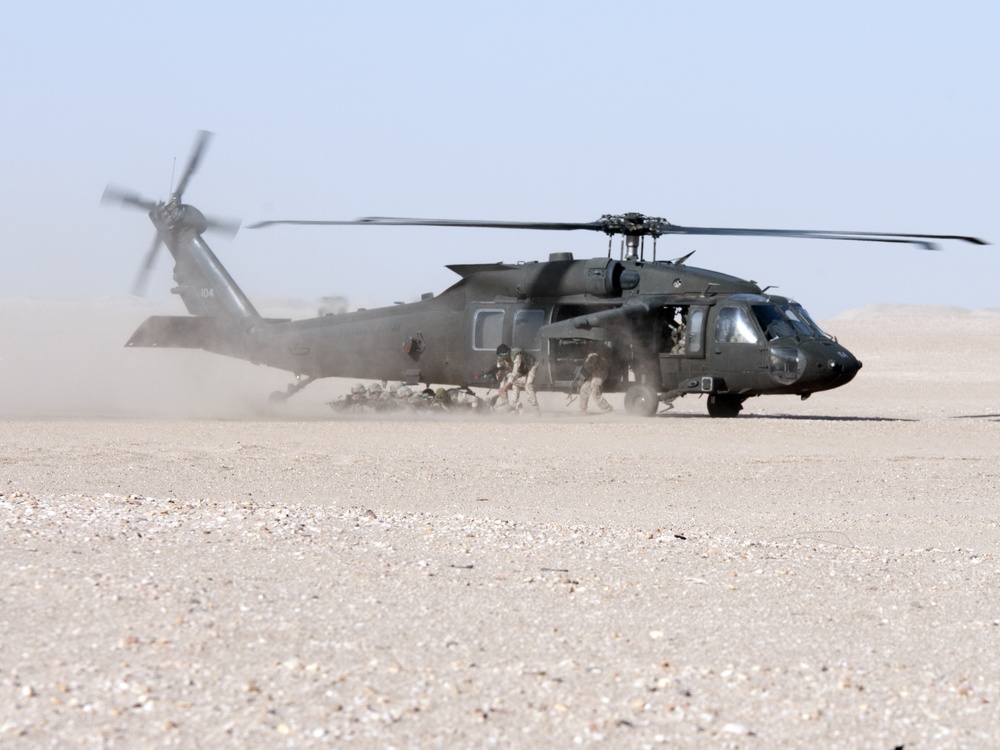 Soldiers dismount Helicopter during joint training mission