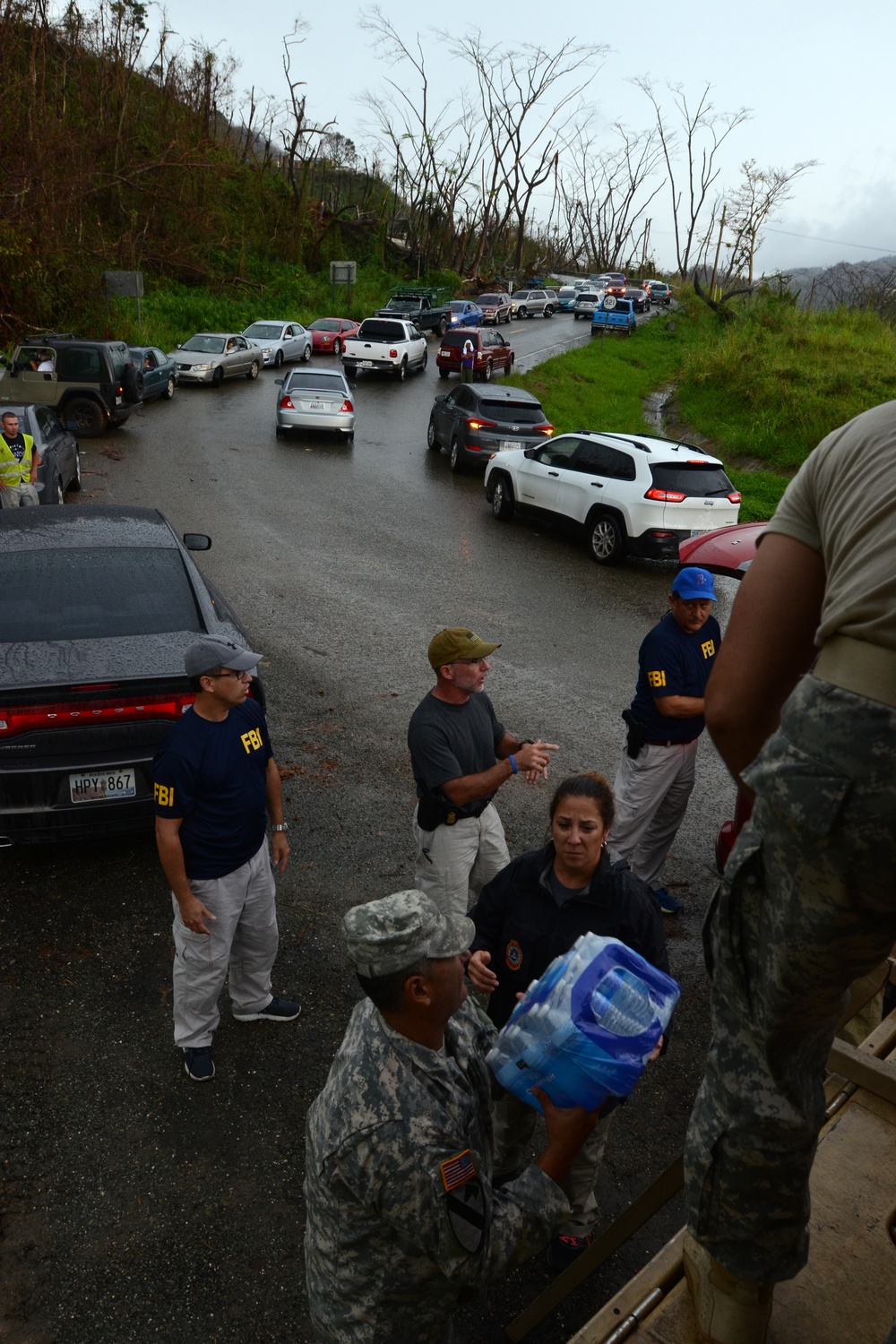 FBI, reservists deliver food, water to residents in remote areas of Adjuntas Puerto Rico
