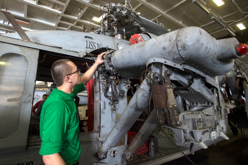Sailors Conduct Maintenance in Nimitz Hangar Bay