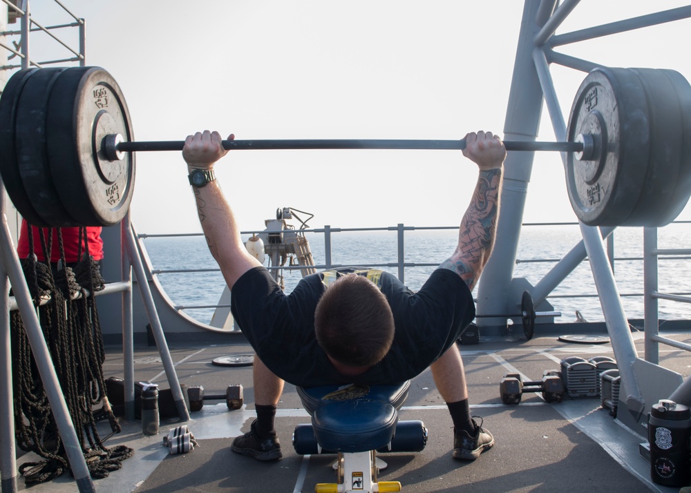 USS Lake Erie (CG 70) Sailor works out