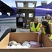 Members of the federal government response prepare to transfer pallets of infant care items to Puerto Rican families in need