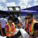 Secretary of the Puerto Rico Department of Family and responders unload infant care goods for distribution to families in need