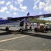 Secretary of the Puerto Rico Department of Family and responders unload infant care goods for distribution to families in need