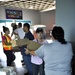 Secretary of the Puerto Rico Department of Family and responders unload infant care goods for distribution to families in need