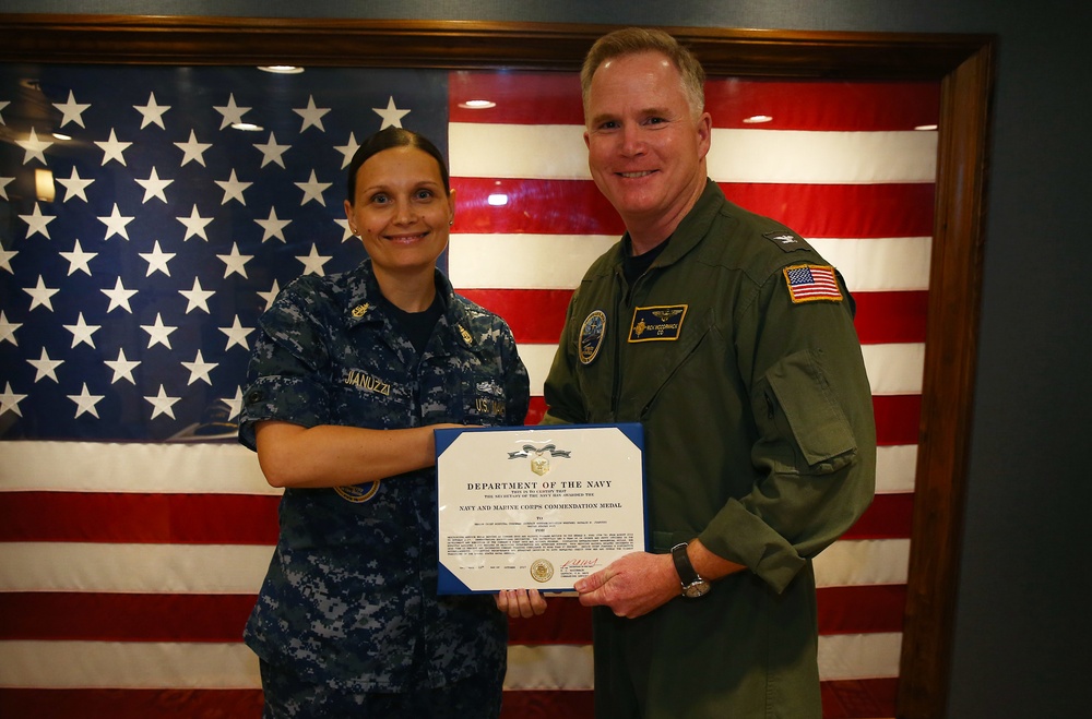 Senior Chief Natalie Jianuzzi accepts an end of tour award